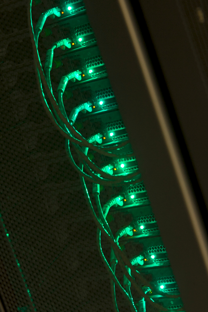 Green lights on a rack of servers in a datacenter