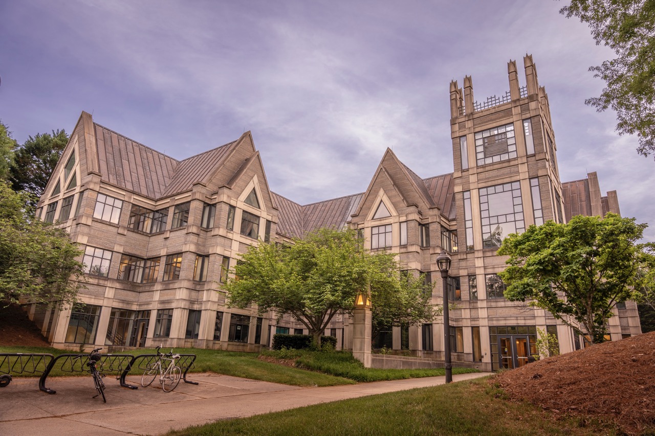 The Sanford School of Public Policy building at dusk