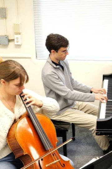 Students performing together on cello and piano as part of the Duke Arts Exchange.
